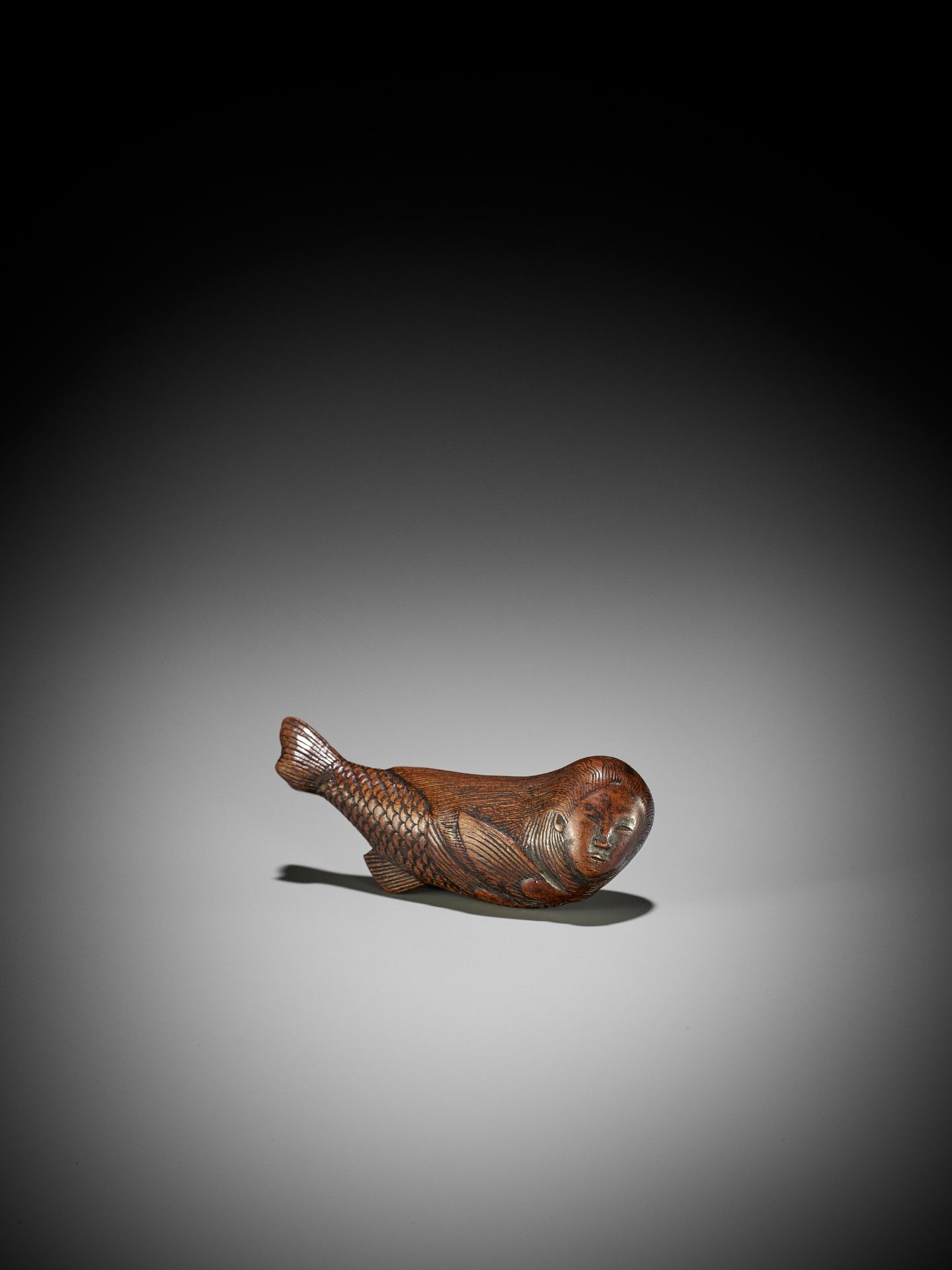 AN UNUSUAL WOOD NETSUKE OF A SWIMMING NINGYO (MERMAID) - Image 3 of 10