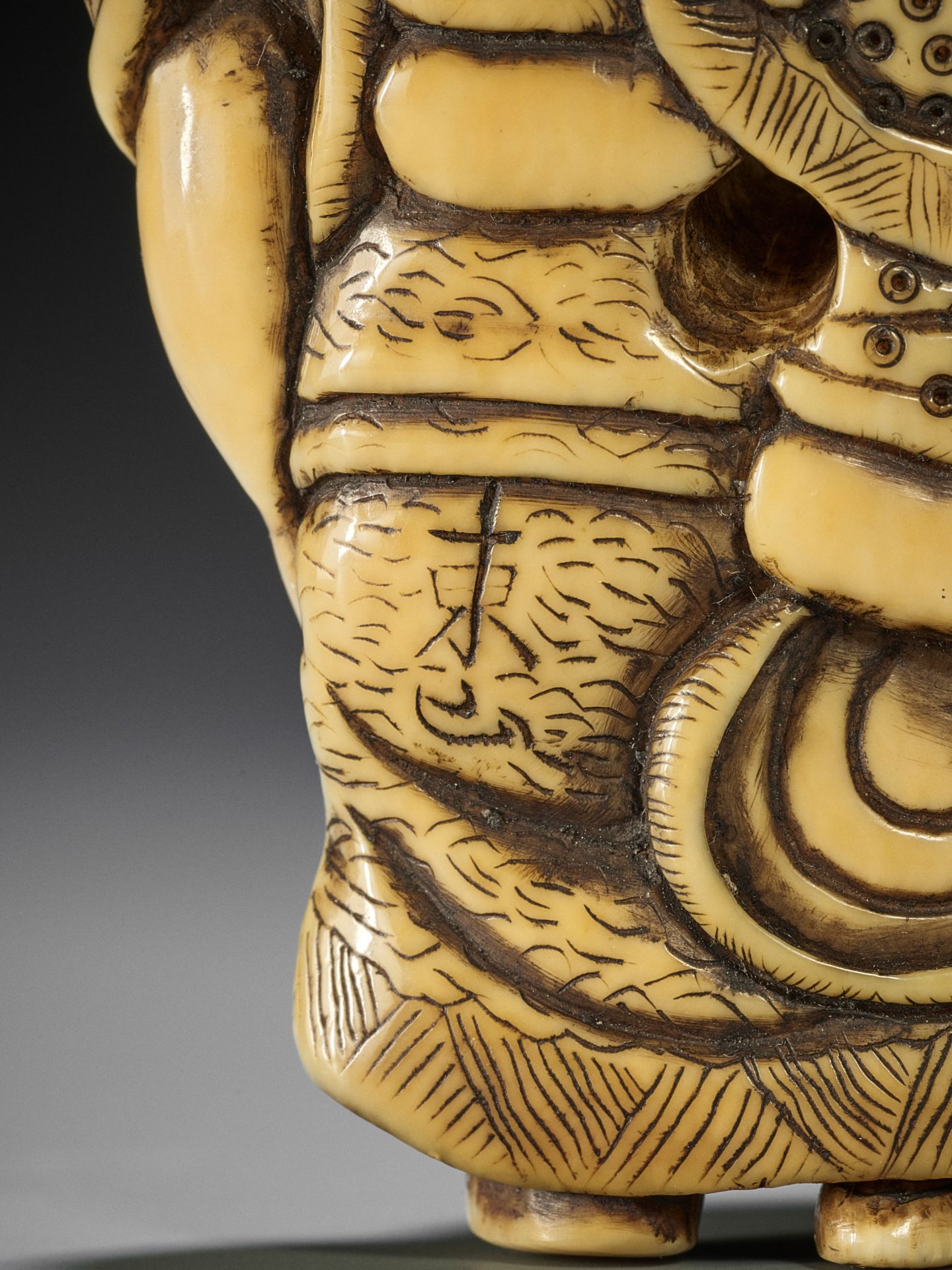 TOZAN: A SUPERB AND LARGE IVORY NETSUKE OF HOTEI WITH KARAKO - Image 16 of 16