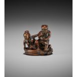 SENSEI: A RARE WOOD NETSUKE OF RAIJIN AND OKAME IN A BATHTUB