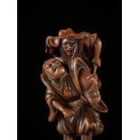 A SUPERB EDO SCHOOL WOOD NETSUKE OF OMORI HIKOSHICHI ENCOUNTERING A DEMON