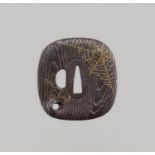 SHOAMI MOTOSHIGE: A RARE IRON TSUBA WITH GOLD SPIDER WEB