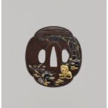 A GOTO SCHOOL SHIBUICHI TSUBA WITH TIGER, BAMBOO, AND WATERFALL