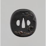 AN IRON TSUBA WITH OXEN