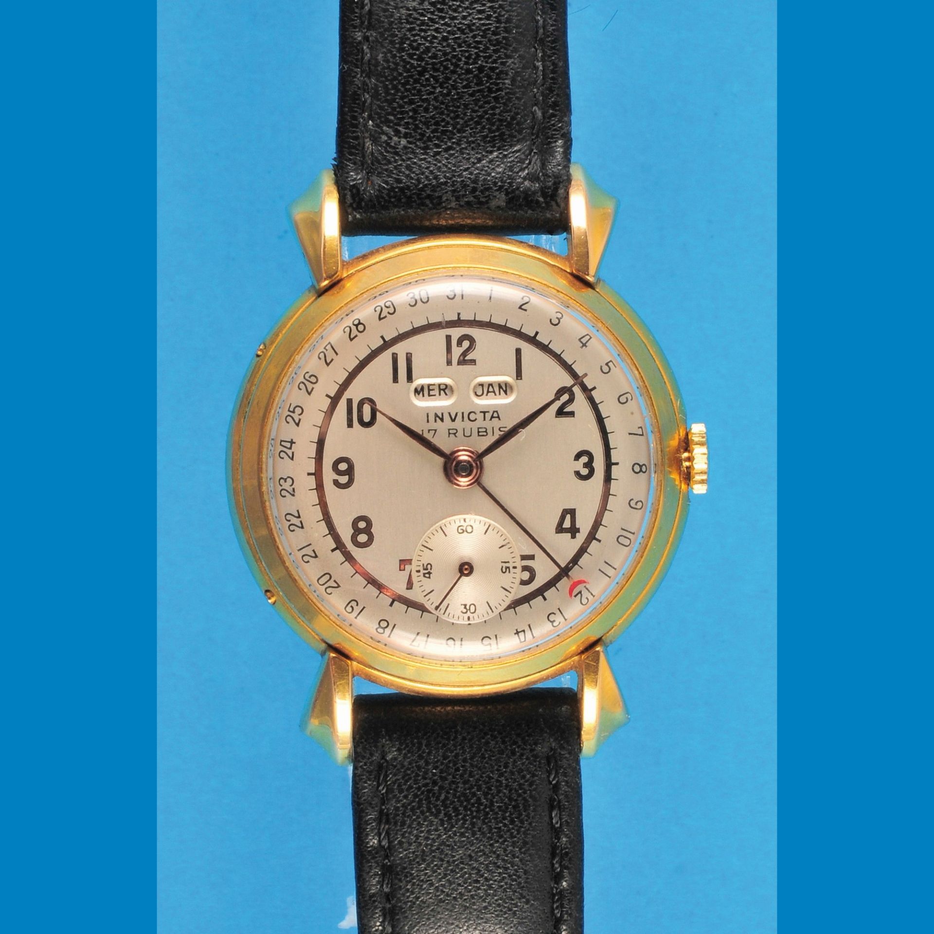 Gold plated Invicta wristwatch with triple -calendar