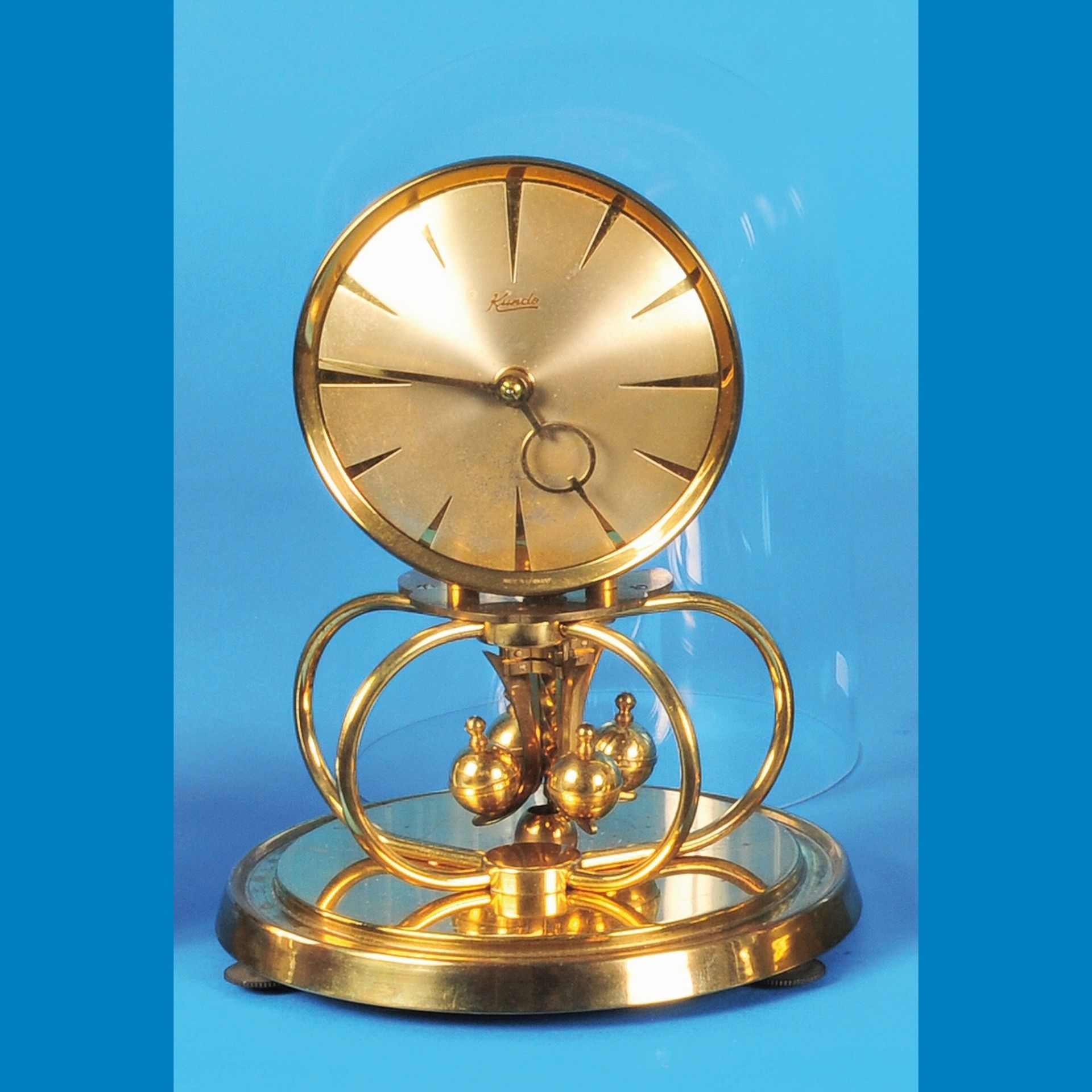 Kundo table clock under glass dome with rotating pendulum, Kieninger & Obergfell