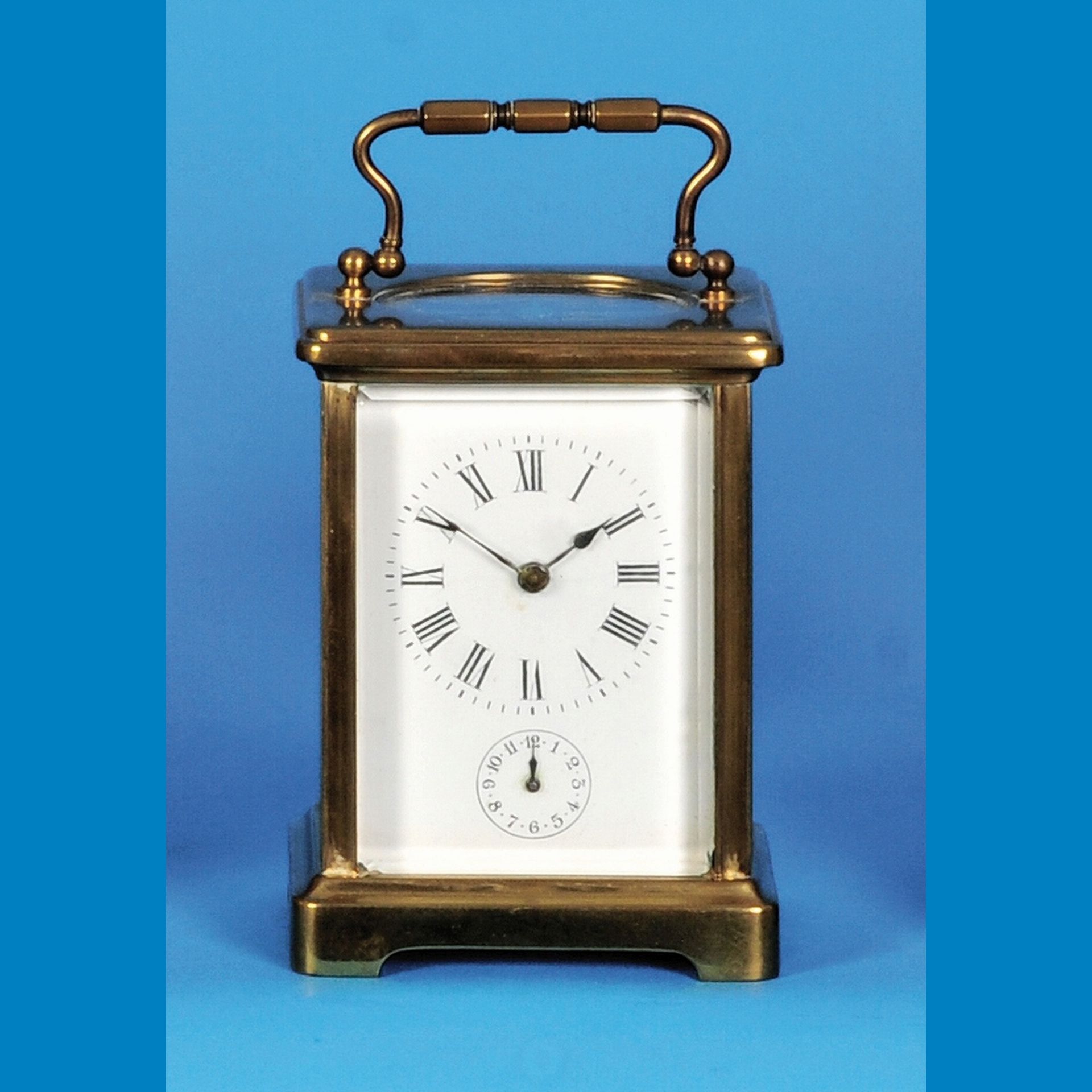 Travel clock with alarm on bell