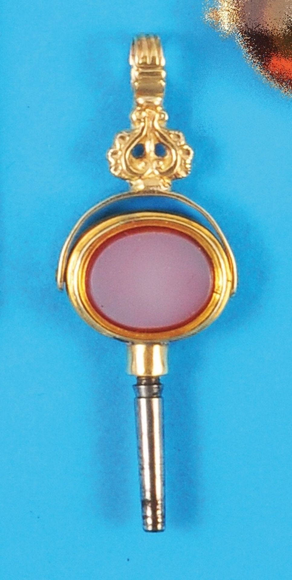 Golden pocket watch key