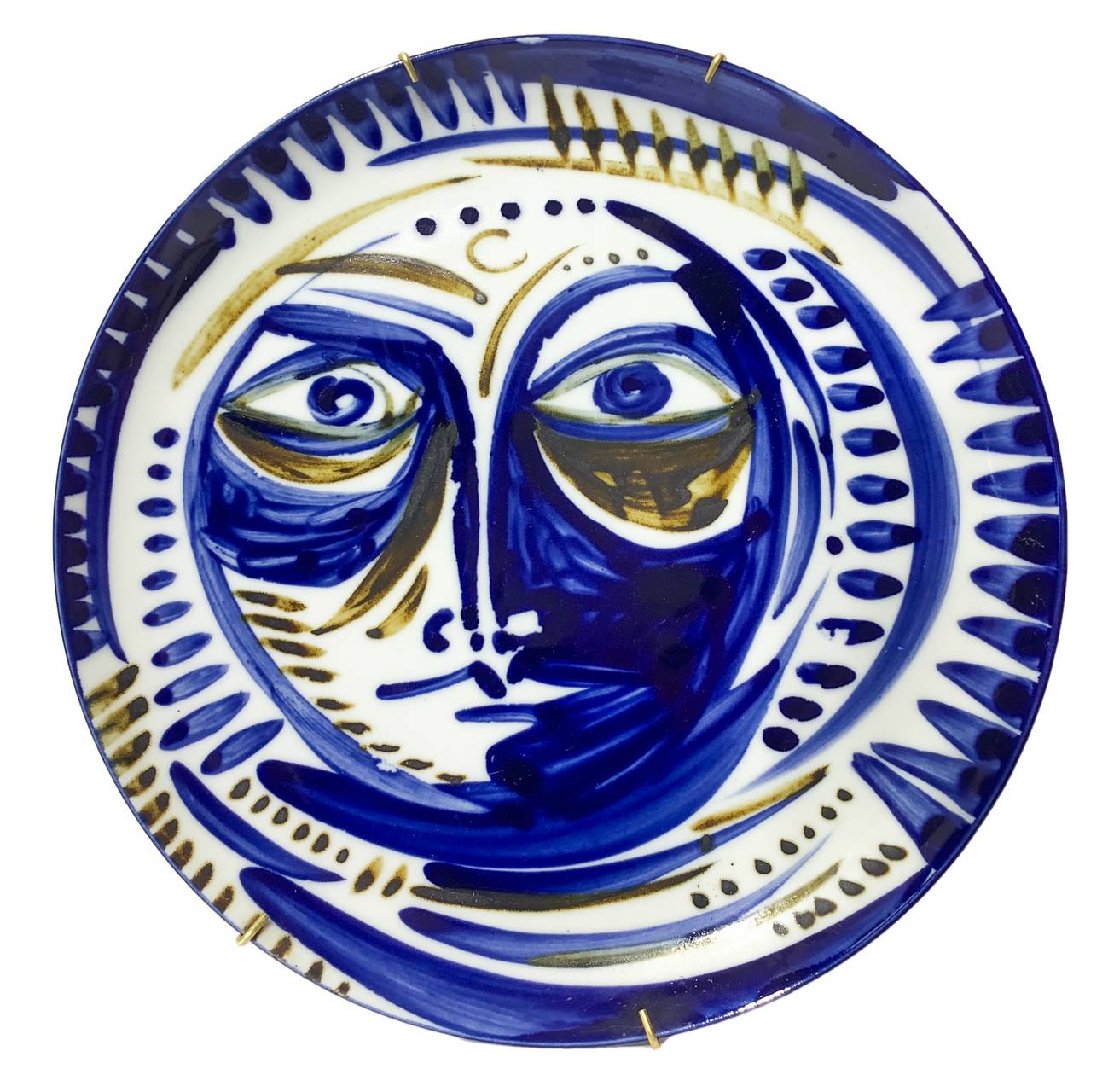 Wall Plate porcelain depicting his face in shades of blue, in the style of Vallaurice ceramics. Diam