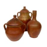 Three vases in terracotta, red rust color. H 33 cm; cm and 26 cm21