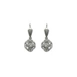 Earrings with pendants in the dome in white gold and diamonds. Gr 6.6