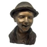Brown patinated bronze lost-wax depicting boy with hat. H 33 cm.