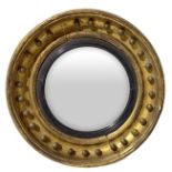 Round convex mirror with gilded frame in gold leaf, mid-nineteenth century. Diameter 50 cm, depth 10