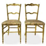 Pair of gilded wooden chairs chiavarine, late nineteenth century. silk cloth seat. Lack of a side ba