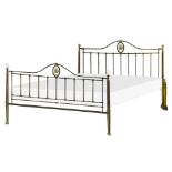Elegant brass bed frame from the nineteenth century, with porcelain medallion on headboard and footb