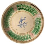 Majolica plate of Caltagirone, early 20th Century. Decorated with flower. 33 Cm