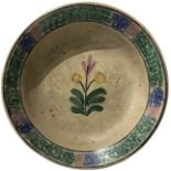 Majolica plate of Caltagirone, Sicily, early twentieth century. Decorated with a flower in shades of