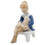 Copenhagen porcelain figurine depicting a child with a shoe. H 15 cm