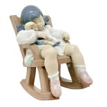 Copenhagen porcelain figurine depicting a child with rocker. H 14 cm