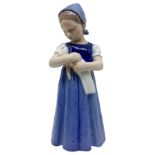 Copenhagen porcelain figurine depicting a child with doll. H 20 cm