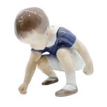 Copenhagen porcelain figurine depicting child who picks up an object. H 10x10 cm