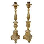 Pair of gilded wooden candlesticks. Late eighteenth century. H 62 cm