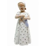 Copenhagen porcelain figurine depicting a child with doll. H 20 cm