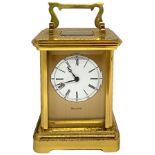 Bulova, travel alarm clock in box with gold metal structure and bevelled glass, manual winding. H cm