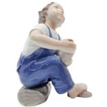 Copenhagen porcelain figurines depicting child with slipper. H 14 cm