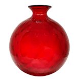 Production Venini, mod. Balloton. Glass vase in red garnet tones, machined surface quilted, signatur