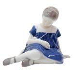 Copenhagen porcelain figurine depicting little girl sitting with doll