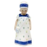 Copenhagen porcelain figurine depicting a child with borsa.Limited edition. H 18 cm