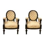 Pair of armchairs in black ebonized wood with oval back, borders Golden brass upholstery in quilted