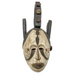 Igbo female mask, circa 1950. Nigeria. H 57 cm