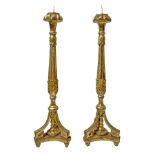 Pair of gilded wooden candlesticks. Late eighteenth century. H 78 cm