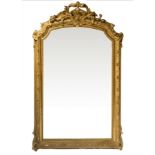 Mirror in gilded wood leafy topped by cymatium,. 155x110 cm