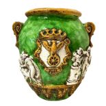 Cachepot in green and yellow tiled with white figures in relief. Caltagirone. XX century. H 45 cm, 2