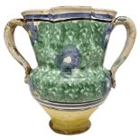 Two-handled vase, early twentieth century. With scalloped mouth. H cm 19. With decorations in shades