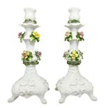 Pair of white candlesticks in the Capodimonte porcelain with white and polychrome floral decorzione