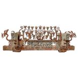 Portion of handcart,. In polychrome wood carved cherubs, gargoyles and wrought iron at the forge in