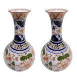 Pair of porcelain vases with orange flower decoration on a white background, China. H 33 cm