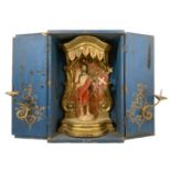 Travel Altar in wooden casket colored powder blue, inside canopy of gilded wood with a wooden statue