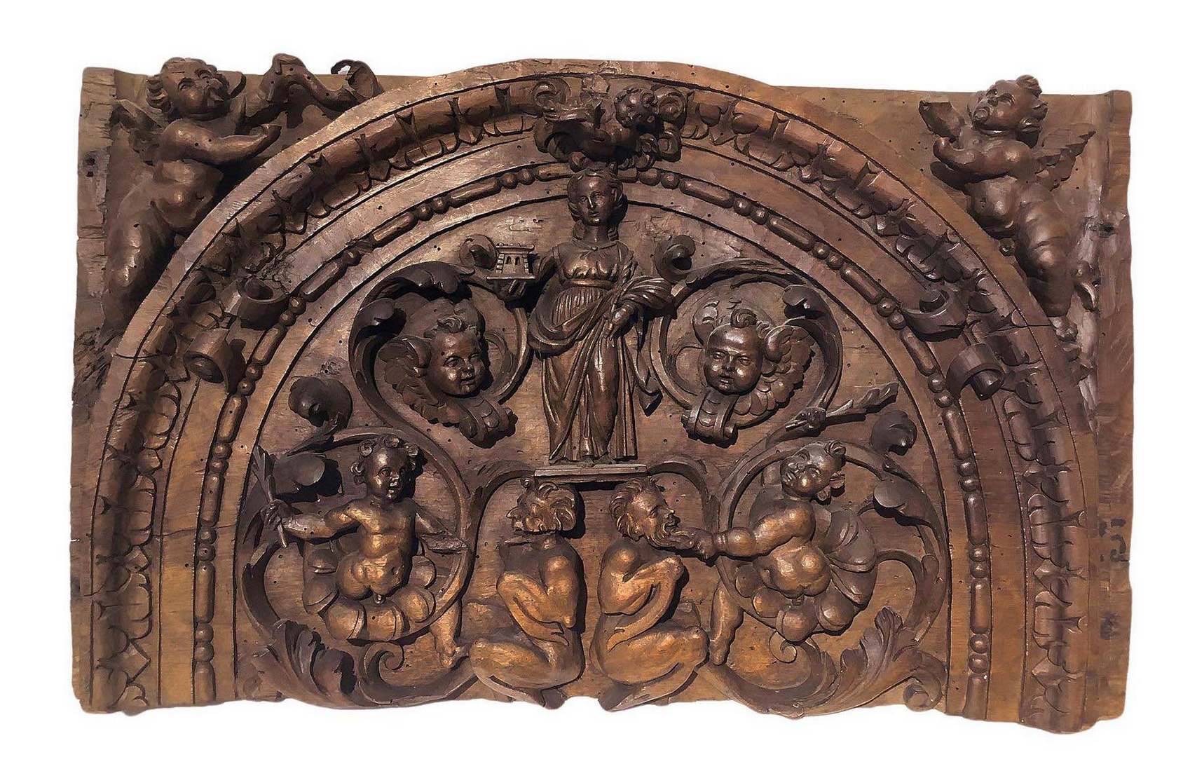 Fragment of walnut wood carved frieze depicting Santa Barbara with putti and satyrs, XVII / XVIII ce