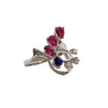 White gold ring with three rubies, one sapphire blue and bright 3