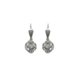 Earrings with pendants in the dome in white gold and diamonds. Gr 6.6