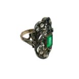 Gold and silver ring with root rectangular emerald in the center and small roses of diamonds. Mis. 2