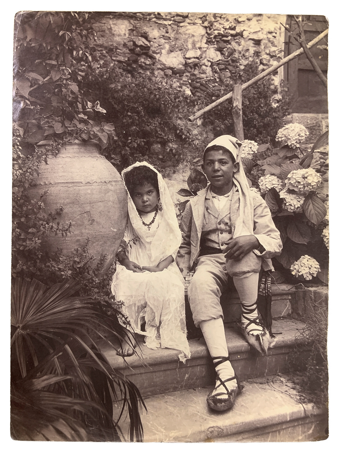 Wilhelm von Gloeden (1856-1931), albumin photos depicting couple of kids in costume Sicilian villa.