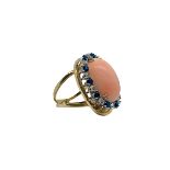 Yellow gold ring with pink coral Deep sea oval and round in white gold with diamonds and blue sapphi