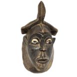 Baule mask, Ivory Coast, the second half of the twentieth century. H cm 40. Break