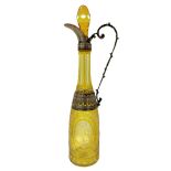 Bohemian bourished glass bottle in yellow shades with silver details.