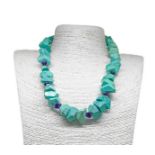 Turquoise necklace with framed geometric elements by faceted amethyst, silver lock. Length 54 cm